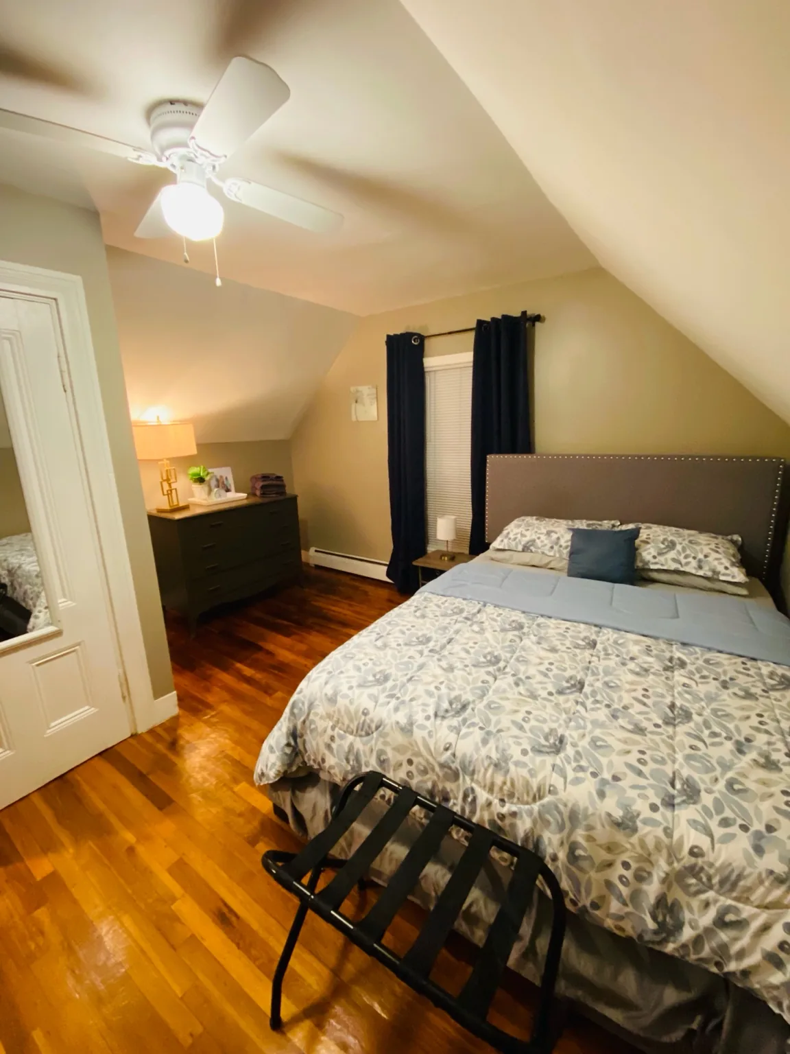 Comfortable bedroom with hardwood floors